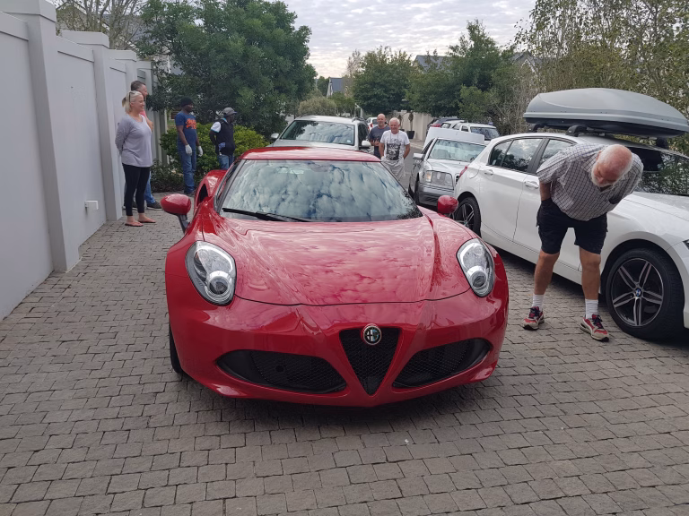 Alfa Romeo 4C grabbing the neighbouars attention of a full detail including paint correction and ceramic coating