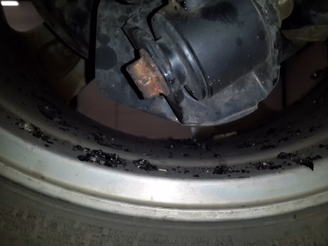 Hardened tar on Toyora RAV4 underbody and wheels removed